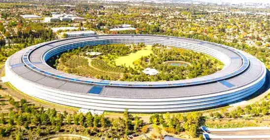 The Apple campus in California, nestled amidst lush trees, showcases a serene and nature-filled environment.